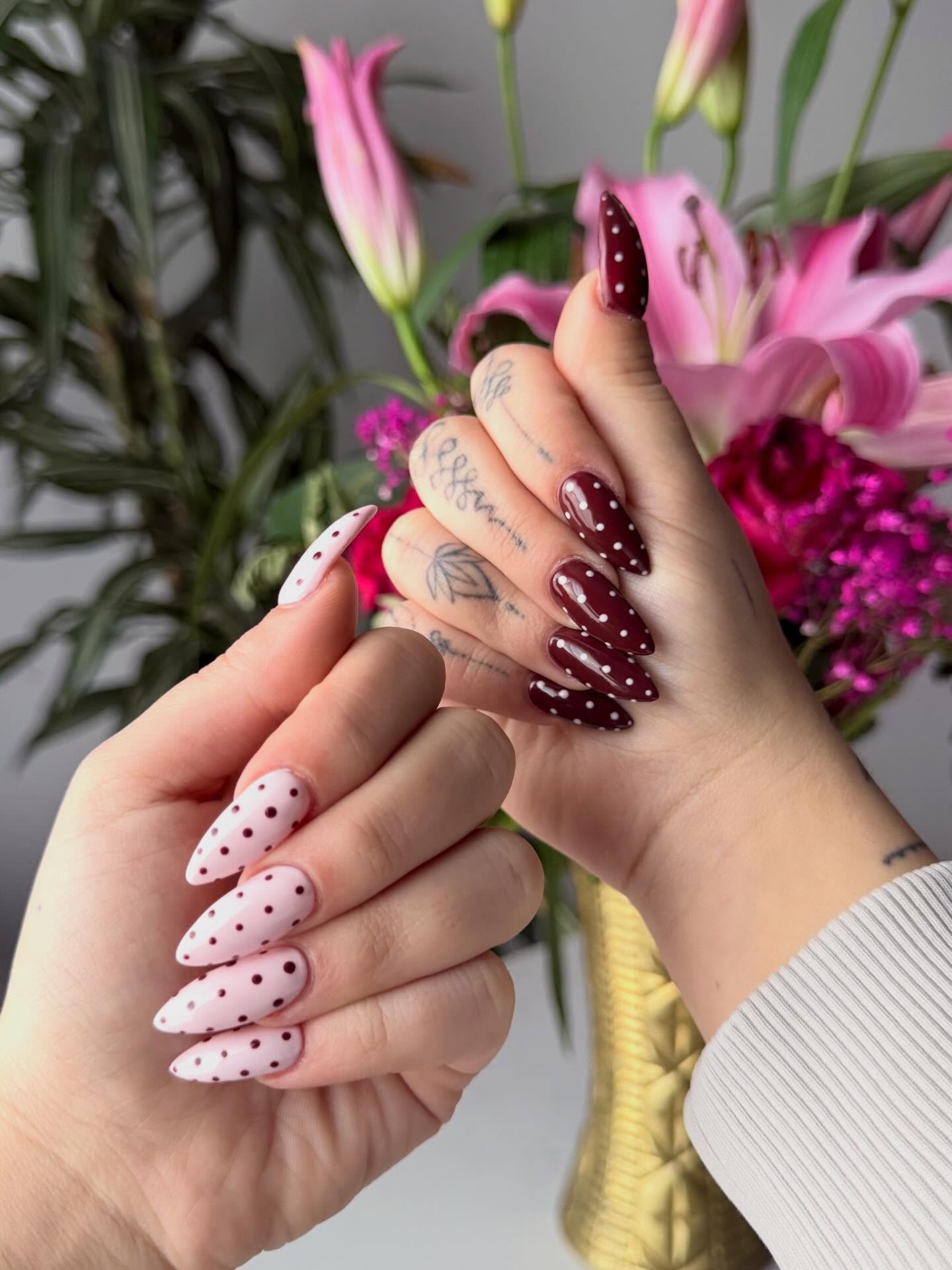 Burgundy and pink polka dot stiletto nails